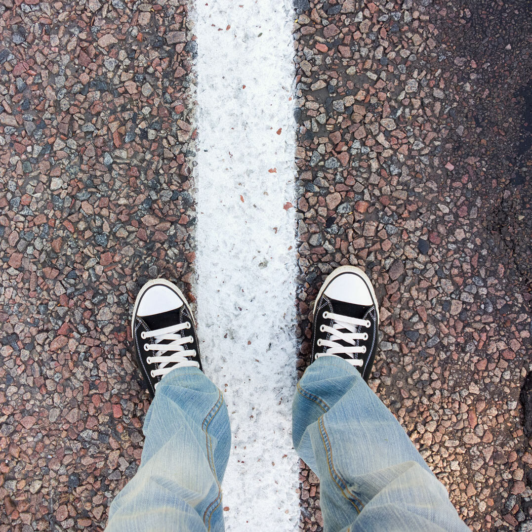 Feet on the asphalt.
